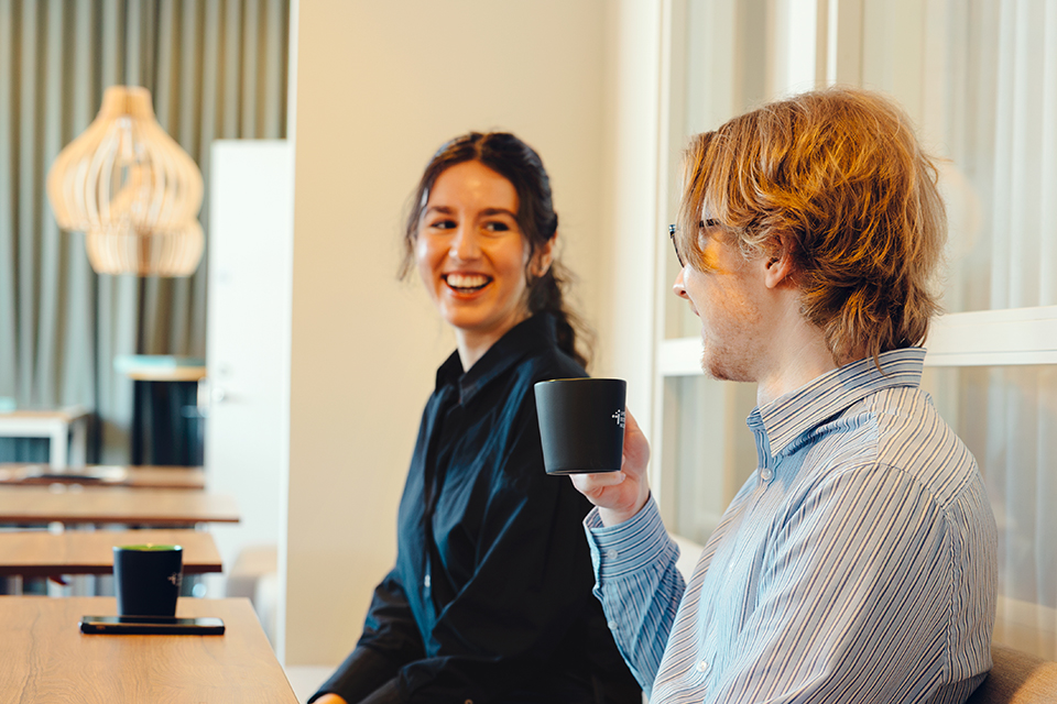 Man and woman talking over coffee